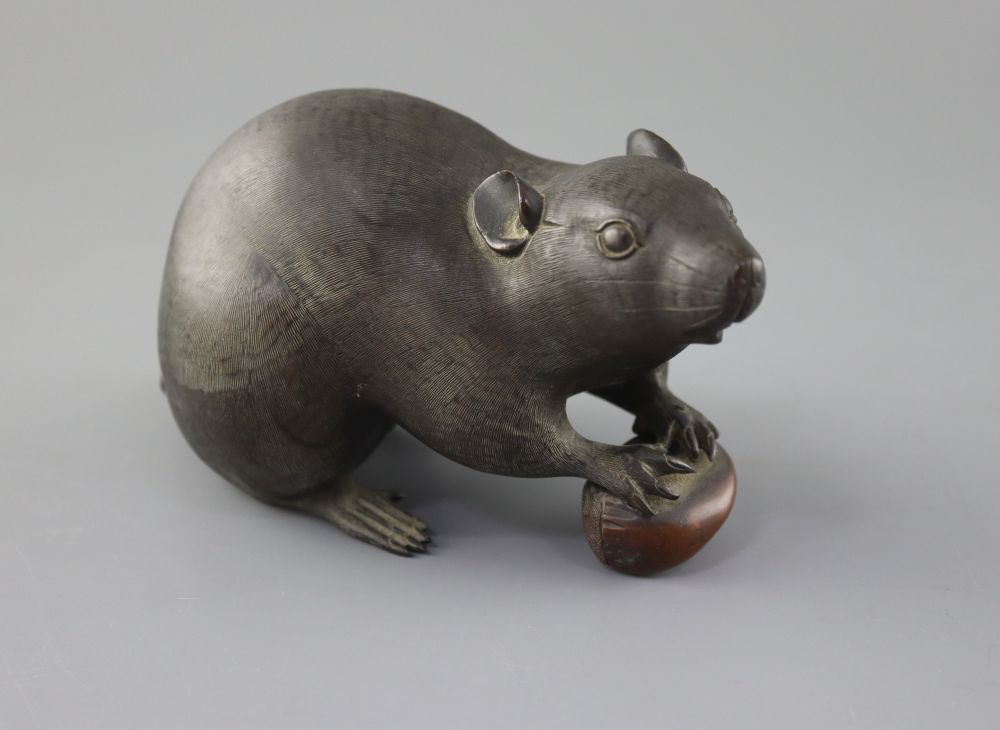 A Japanese bronze rat with acorn, Meiji period, signed, length 18cm